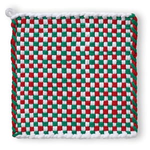 May include: A square, woven hot pad in a checkerboard pattern of red, green, and white. The edges are trimmed with a white rope-like border and a small loop for hanging. The design is reminiscent of holiday decor.