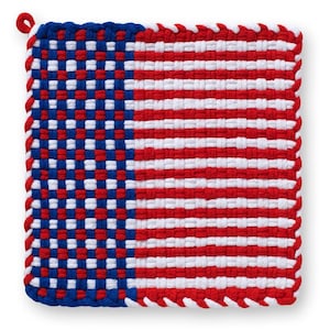 May include: Woven pot holder with a design resembling the American flag. The square pot holder features a blue and white checkered pattern on the left side and red and white stripes on the right. A loop is attached for hanging.