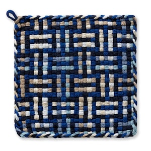 May include: Square woven potholder in shades of blue, beige, and white. The potholder features a geometric pattern and a loop for hanging. The edges are finished with a braided trim. A kitchen accessory.