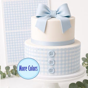 May include: A two-tiered cake decorated with a light blue and white gingham plaid pattern wrap, featuring three light blue buttons on the bottom tier and a large light blue bow on the top tier. Text reads GINGHAM PLAID PATTERN Cake Wraps More Colors.