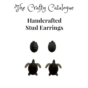 May include: Handcrafted black turtle stud earrings. The earrings feature a turtle design with a detailed shell.
