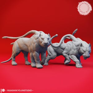 May include: Two gray, muscular lion-like sculptures with long, curved tails and horns. The sculptures are on a red background. The sculptures are in a dynamic pose, one standing and the other in a stalking position. The sculptures are from YASASHIIKYOJINSTUDIO.