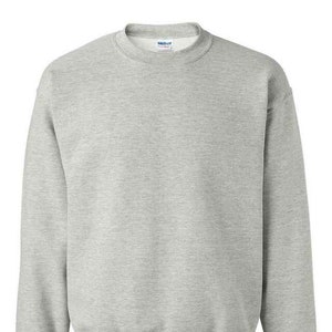May include: A plain grey sweatshirt with a crew neck and long sleeves.