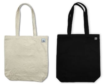 May include: Two tote bags, one beige and one black, both with a small black logo that says "SA".