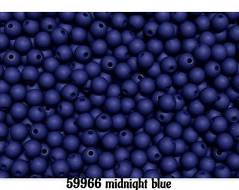May include: A close-up shot of numerous midnight blue wooden beads. Each bead is round with a hole through the center. The text "59966 midnight blue" is at the bottom. These beads are suitable for jewelry making and crafts.