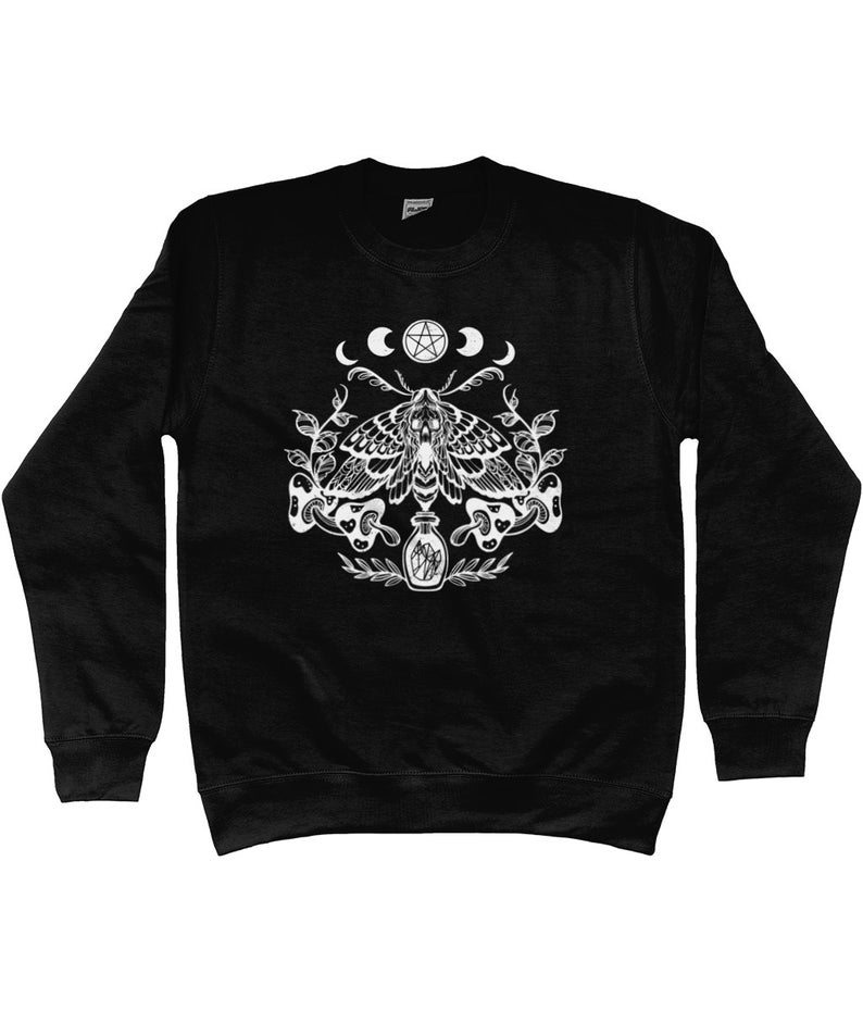 May include: Black sweatshirt with a white graphic design of a moth with a pentagram and crescent moons above it. The moth is surrounded by leaves and a bottle with crystals inside.