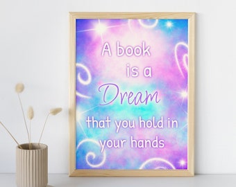 May include: A framed print with a colorful galaxy background and the quote "A book is a dream that you hold in your hands".