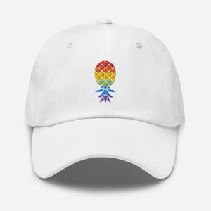 May include: White baseball cap with a rainbow pineapple embroidered on the front.