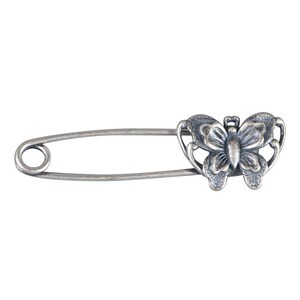 May include: Silver safety pin with a butterfly design. The butterfly is detailed with intricate wings and a body.