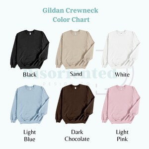 May include: Color chart showing different Gildan crewneck sweatshirt colors. The colors are: black, sand, white, light blue, dark chocolate, and light pink.
