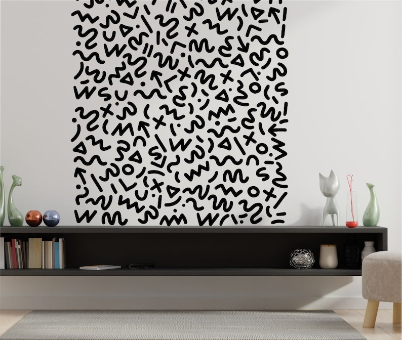 May include: Black and white abstract pattern with a variety of shapes and lines, including wavy lines, circles, and squares. The pattern is on a white background and is a wall decal.