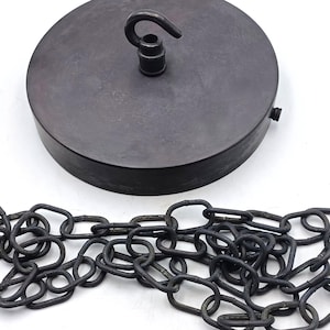 May include: A dark grey ceiling rose with a hook and a matching chain. The rose is round and has a matte finish. The chain is made of oval links.