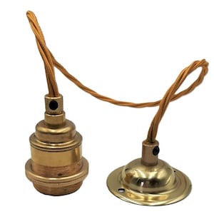 May include: Two brass lamp sockets with a braided cord. One socket has a round base and the other has a threaded base.