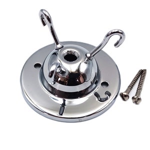 May include: Chrome ceiling fixture with three hooks and two screws. The fixture is designed to hold light bulbs or other hanging objects.