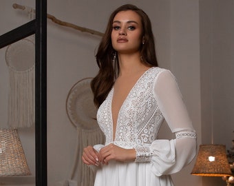 Delicate chiffon wedding dress with French lace - macramé. Dress is complemented by voluminous chiffon sleeves on lace cuffs