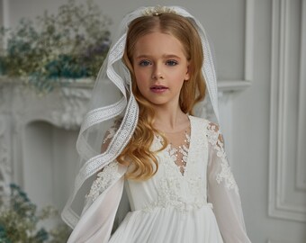 Chiffon communion dress. Ivory children's dress made of delicate chiffon decorated with lace appliques and beads suitable for any occasion