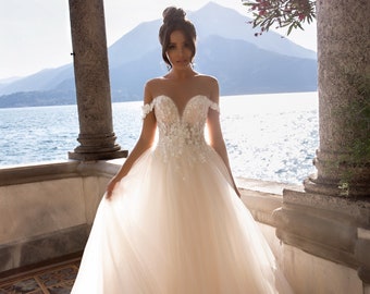 Dream wedding dress. Delicate dress with a tulle skirt and guipure top with 3D flowers, beads and pearls