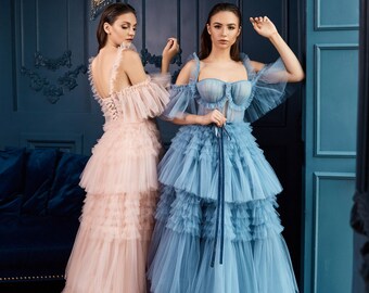 Lavender mood dress. Cascading tulle ruffles lend and the balconette-style bodice. The dress is completed with a dropped sleeve