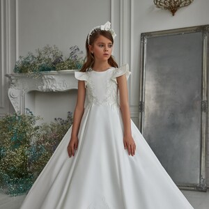 Simple elegant communion dress. Satin communion dress with wings. Baby Communion Dress with Shiny Pattern