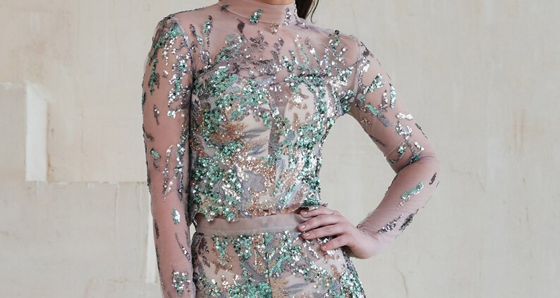 Shining jumpsuit A wonderful elegant set consisting of a blouse with long sleeves and trousers A great alternative to a prom dress