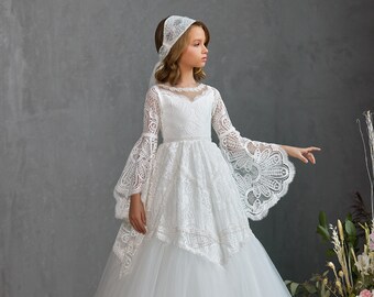 White lace communion dress with long flared lace sleeves. Communion dress with long sleeves. Matte lace communion dress with beads