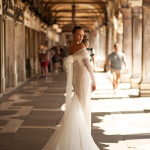 Straight lace wedding dress. Shiny lace dress with long sleeves. Straight shiny dress with a bow. Ivory wedding dress with Godet silhouette image 3