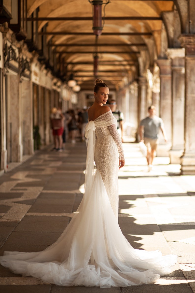 Straight lace wedding dress. Shiny lace dress with long sleeves. Straight shiny dress with a bow. Ivory wedding dress with Godet silhouette image 3