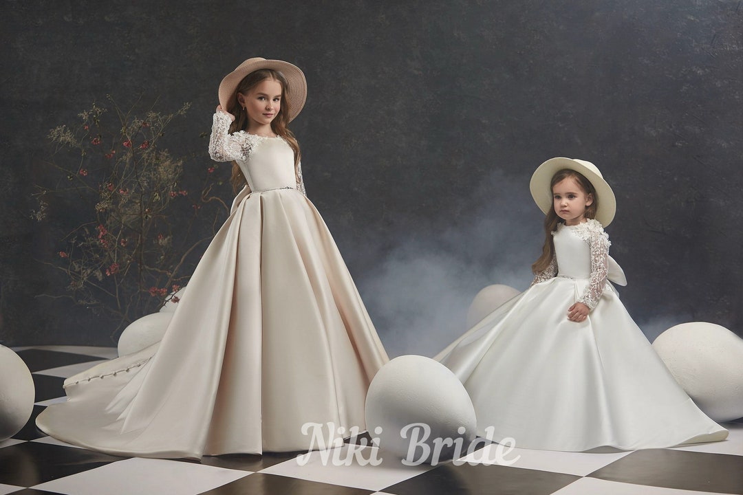 Satin Baby Dress With Lace Sleeve With 3D Flowers. Dress is