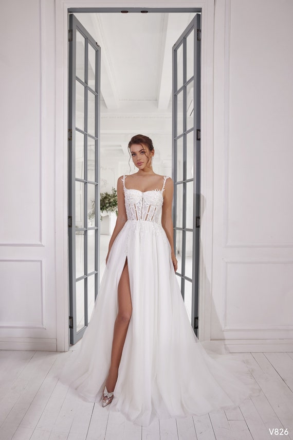 Wedding dress with flowers on bottom 2025