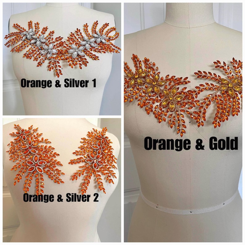 K&ouml;nnte beinhalten: Drei Strass-Applikationen in Orange und Silber oder Gold werden auf Schneiderpuppen gezeigt. Die Applikationen weisen Blumen- und Blattmuster auf. Der Text darunter lautet "Orange & Silver 1", "Orange & Gold" und "Orange & Silver 2".