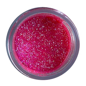 May include: A small jar of pink glitter with a fine, shimmery texture.