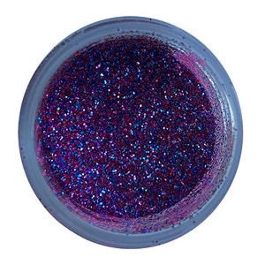 May include: A close-up of a jar filled with iridescent purple and blue glitter.