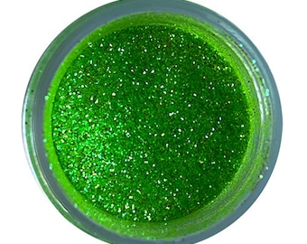 May include: A small jar of bright green glitter.