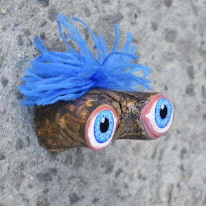 May include: A set of three ceramic mugs with a speckled, matte finish. The mugs are in shades of cream, light gray, and dark gray. Each mug has a simple, minimalist design, perfect for coffee or tea.