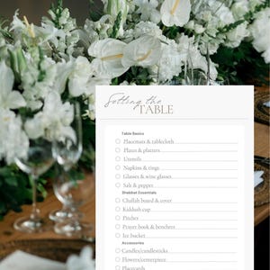 May include: A table setting checklist with the text "Setting the Table" at the top. The list includes items like placemats, plates, utensils, napkins, glasses, salt, and pepper. White flowers and glassware are in the background.