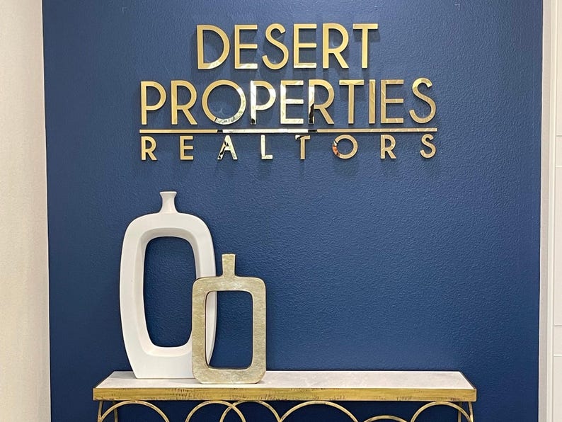 Stainless steel. Depth 1 inch.
It is mounted with double-sided tape. It is an indoor and outdoor sign. There is a screw mounting option. It has a long life. It is not affected by weather conditions.
