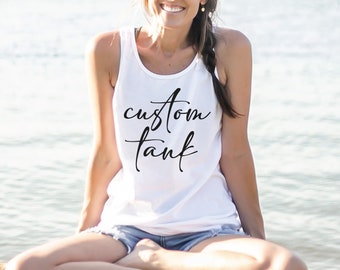 May include: A white tank top with the text "A custom tank" written in black cursive script.