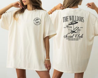 May include: An oversized white t-shirt with a graphic print on the front and back. The front print says "Sophia's Bachelorette South Beach Miami". The back print says "The Williams Social Club Sophia's Bachelorette South Beach Miami Est. 2023".