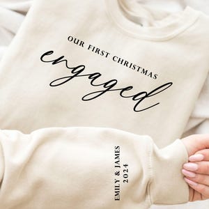 Custom Our First Christmas Engaged Sweatshirt and Shirt, Christmas New Engaged Gift, Xmas Engagement Sweatshirt, Holiday Engagement Party
