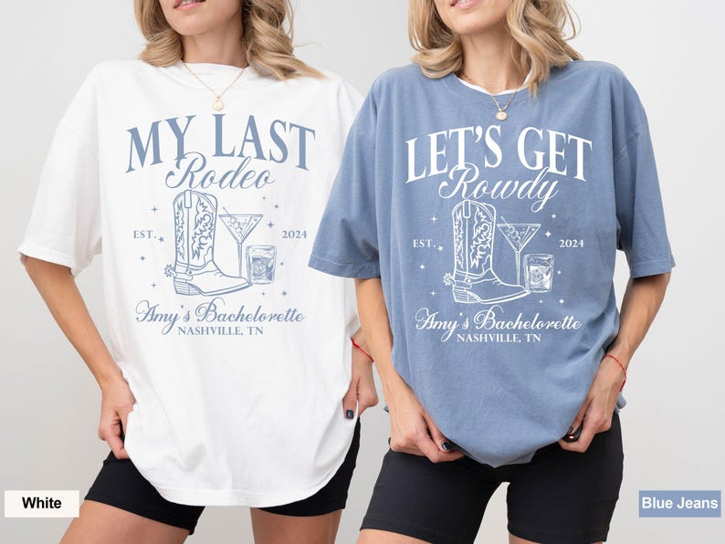 May include: Two white t-shirts with blue text and graphics. The first shirt says "My Last Rodeo" with a boot and a drink graphic. The second shirt says "Let's Get Rowdy" with a boot and a drink graphic. Both shirts say "Amy's Bachelorette Nashville, TN".