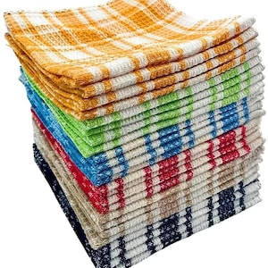 May include: A pile of multi-coloured, checkered kitchen towels. The towels are in shades of orange, green, blue, and red. Each towel has a woven texture and a plaid design. The towels are neatly stacked, displaying the range of colours and patterns.