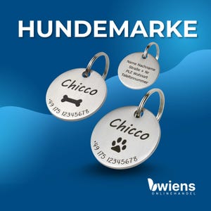 May include: Three circular silver-toned metal pet identification tags with split rings. Two tags feature the name Chicco, a bone or paw print icon, and a phone number. The third tag shows placeholder text for name, address, and phone number.
