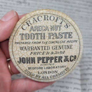 Antike Werbung Cracrofts Areca Nuss Zahnpasta Topfdeckel Apotheker Werbung weißer Eisenstein, doppelseitiger Topfdeckel
