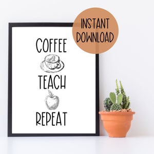 May include: Black framed print with the words "Coffee, Teach, Repeat" in a black font. The words are separated by a drawing of a coffee cup, an apple, and a circle with the words "Instant Download". A small potted cactus sits on a white surface.