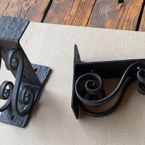 Hand forged metal shelf bracket. Shelves storage.