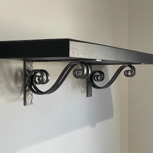 Hand forged metal shelf bracket. Shelves storage.