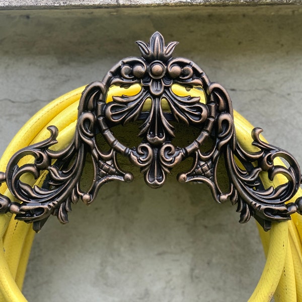 Garden hose holder. Garden decor.