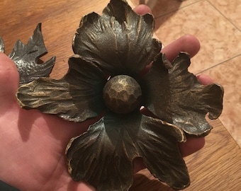 Forged iron flower. Blacksmith supply. Iron elements.