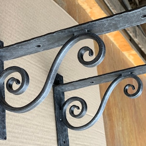 Hand forged metal shelf bracket. Shelf brackets. Corbels.