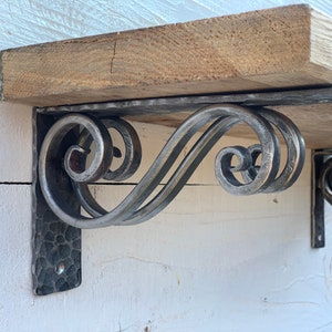 Hand forged metal shelf bracket. Shelves storage.